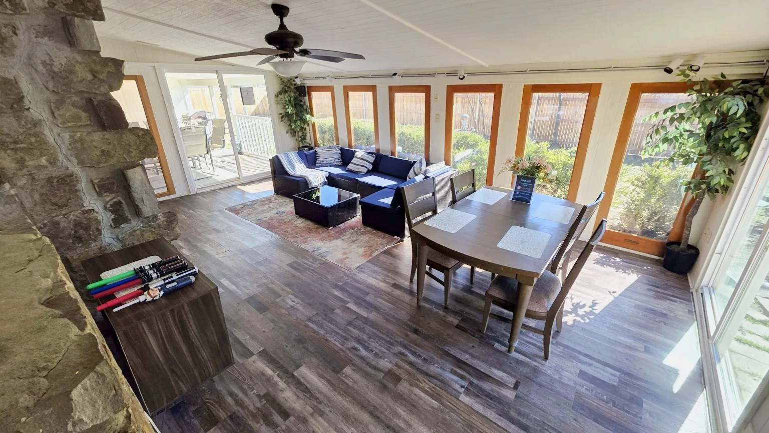 Sunroom lounge and dining area at The Space Place with large windows